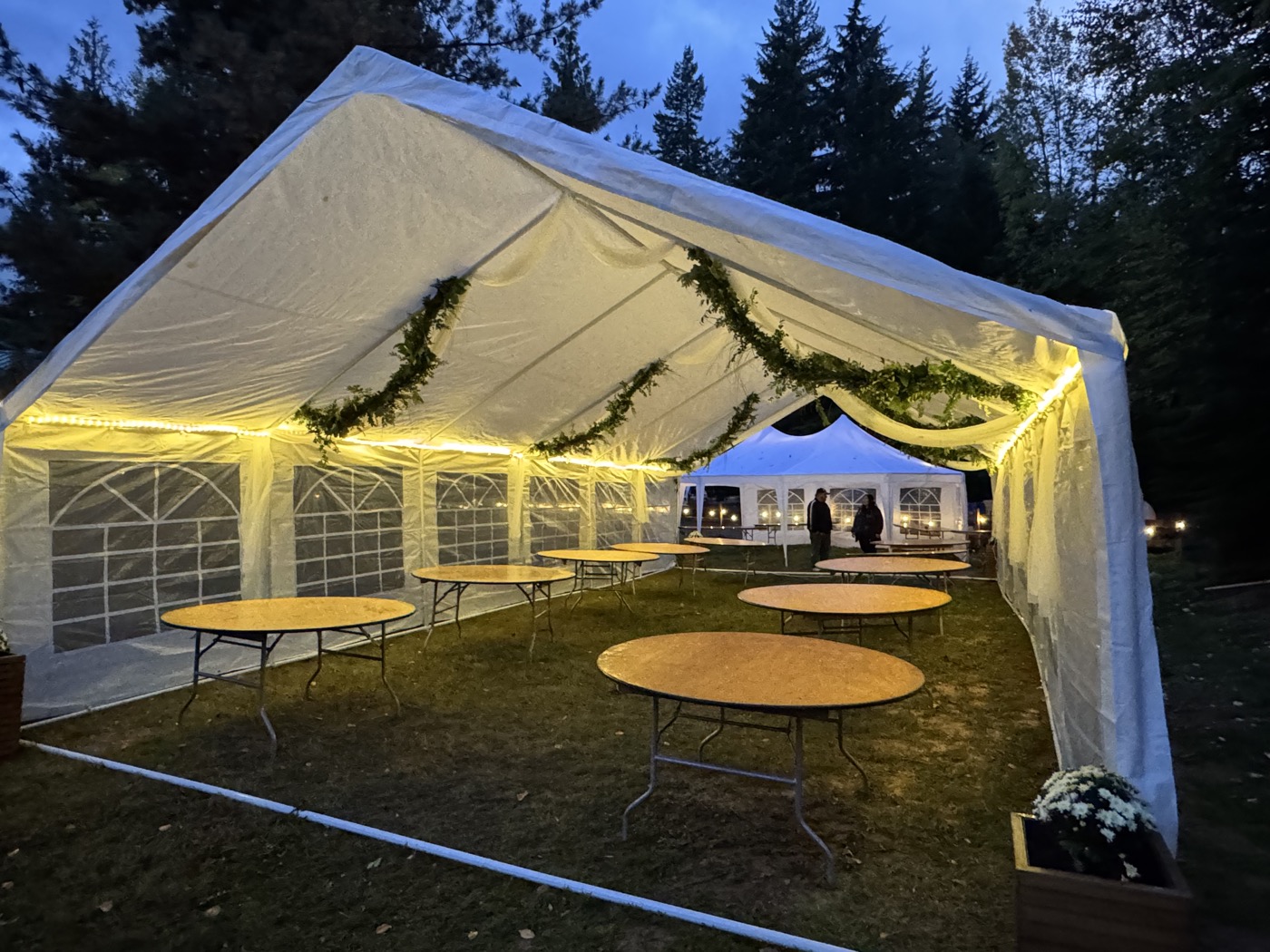 Reception tent with garlands and warm lights